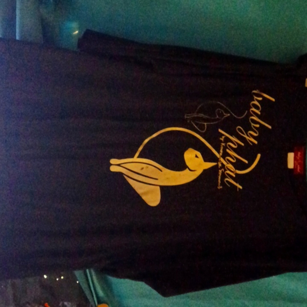 A top that is soft comfortable,  by baby phat 1x and a pair of baby phat jeans .